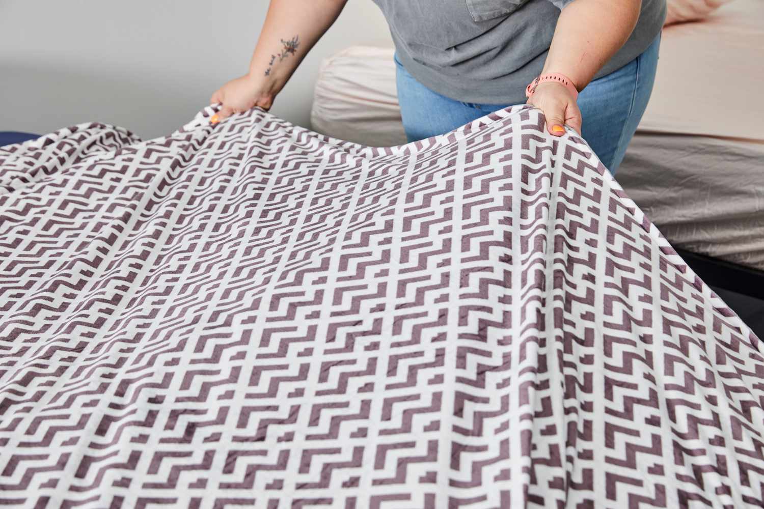 Quility Weighted Blanket with Soft Cover being held by a person