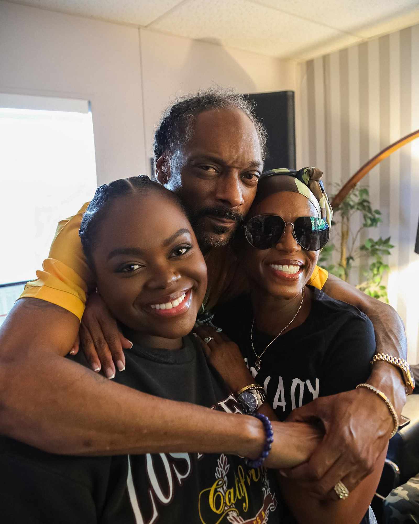 Snoop Dogg, Shantae Broadus, and Cori Broadus.