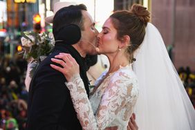 Keven Undergaro (L) and Maria Menounos hold their wedding ceremony during Maria Menounos and Steve Harvey Live from Times Square at Marriott Marquis Times Square on December 31, 2017