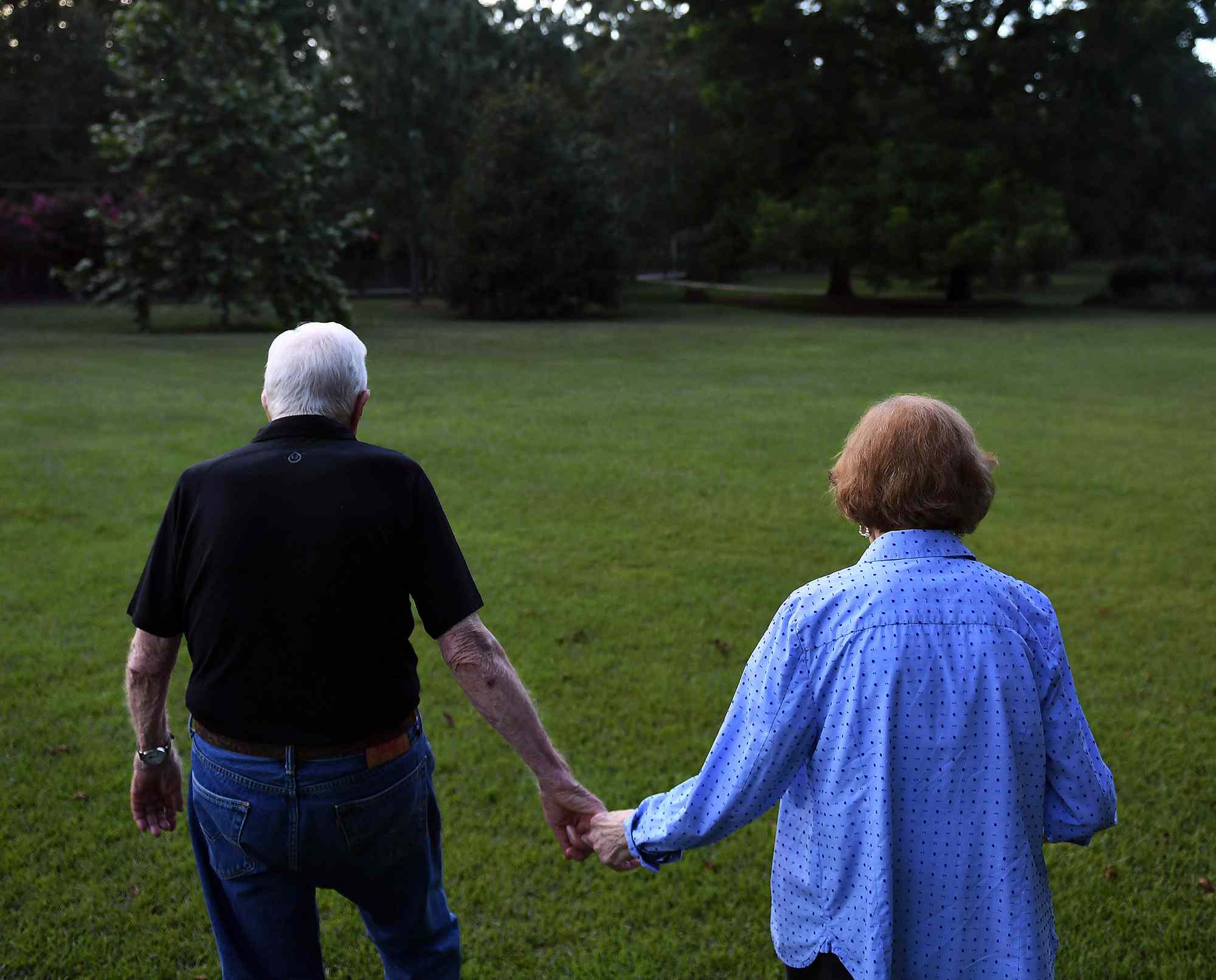 Former President of the United States, Jimmy Carter walks with his wife, former First Lady, Rosalynn Carter towards their home following dinner at a friend's home on Saturday August 04, 2018 in Plains, GA. Born in Plains, GA, President Carter stayed in the town following his presidency
