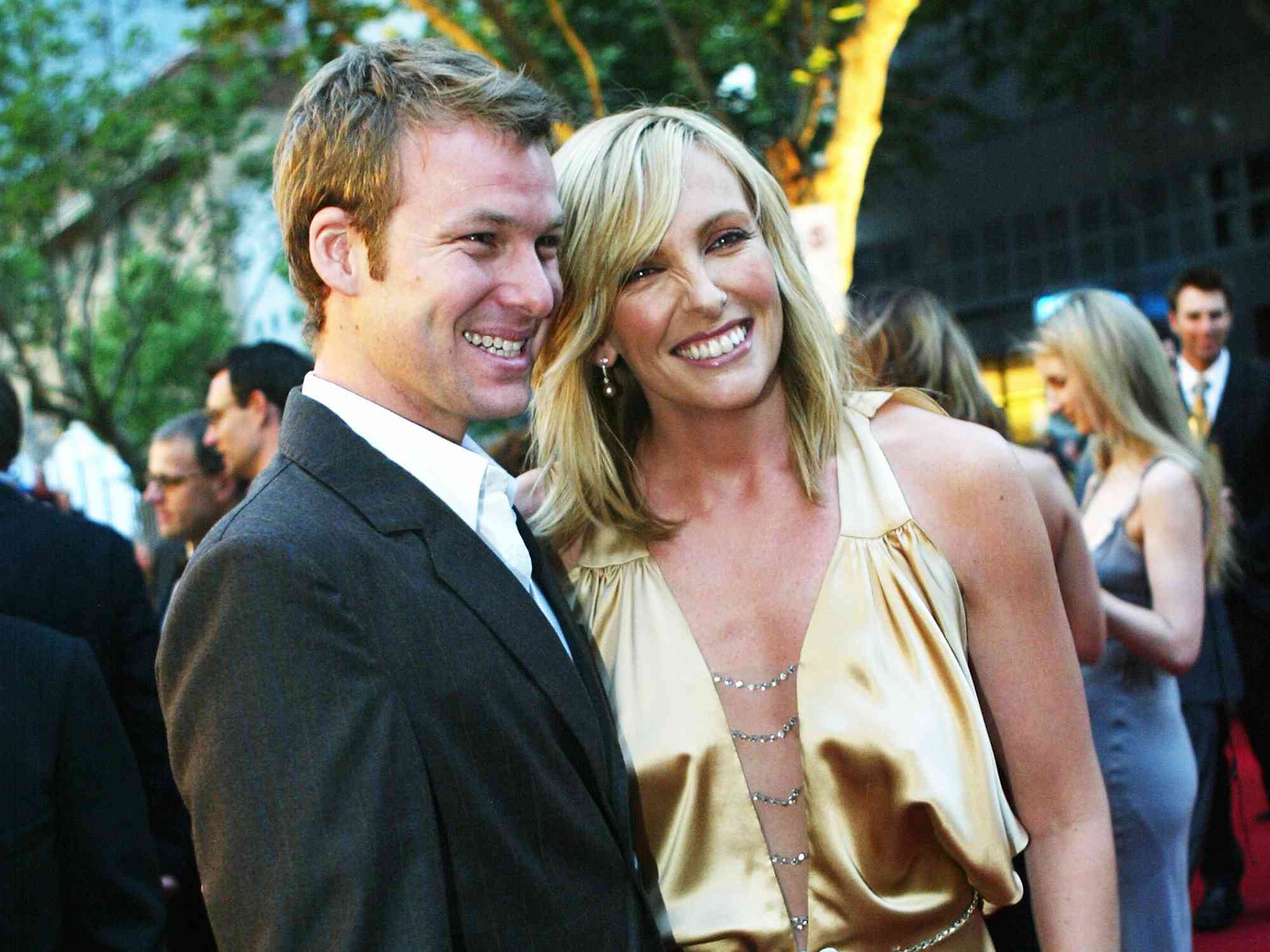 Toni Collete and her husband Dave Galafassi pose for photographs during the red carpet arrivals at the 45th Australian Film Industries Awards 2003 at Her Majesty's Theatre on November 21, 2003 in Melbourne, Australia