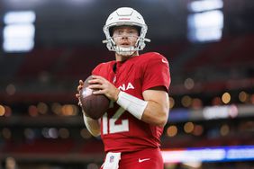 Colt McCoy #12 of the Arizona Cardinals looks to throw a pass during pregame warmups prior to an NFL preseason football game against the Denver Broncos at State Farm Stadium on August 11, 2023 in Glendale, Arizona