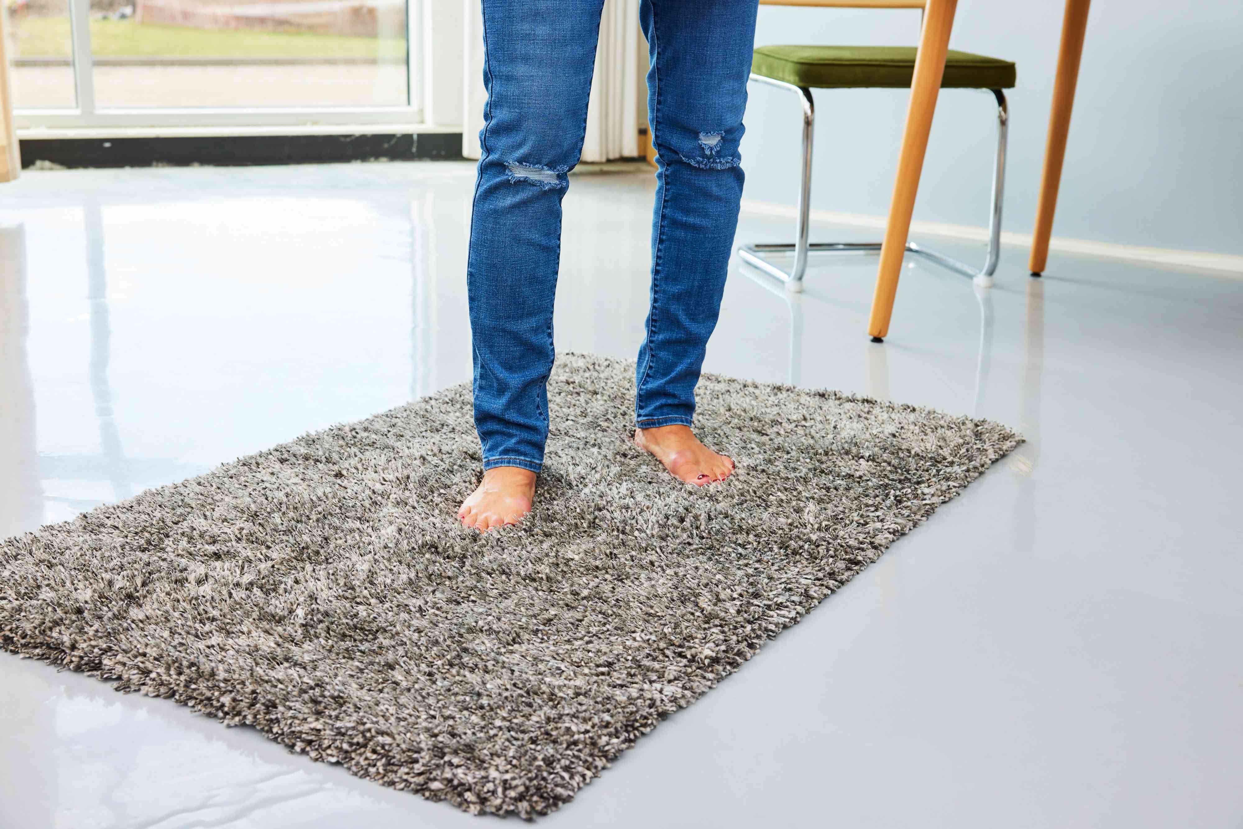 A person stands on the Project 62 Eyelash Woven Shag Rug