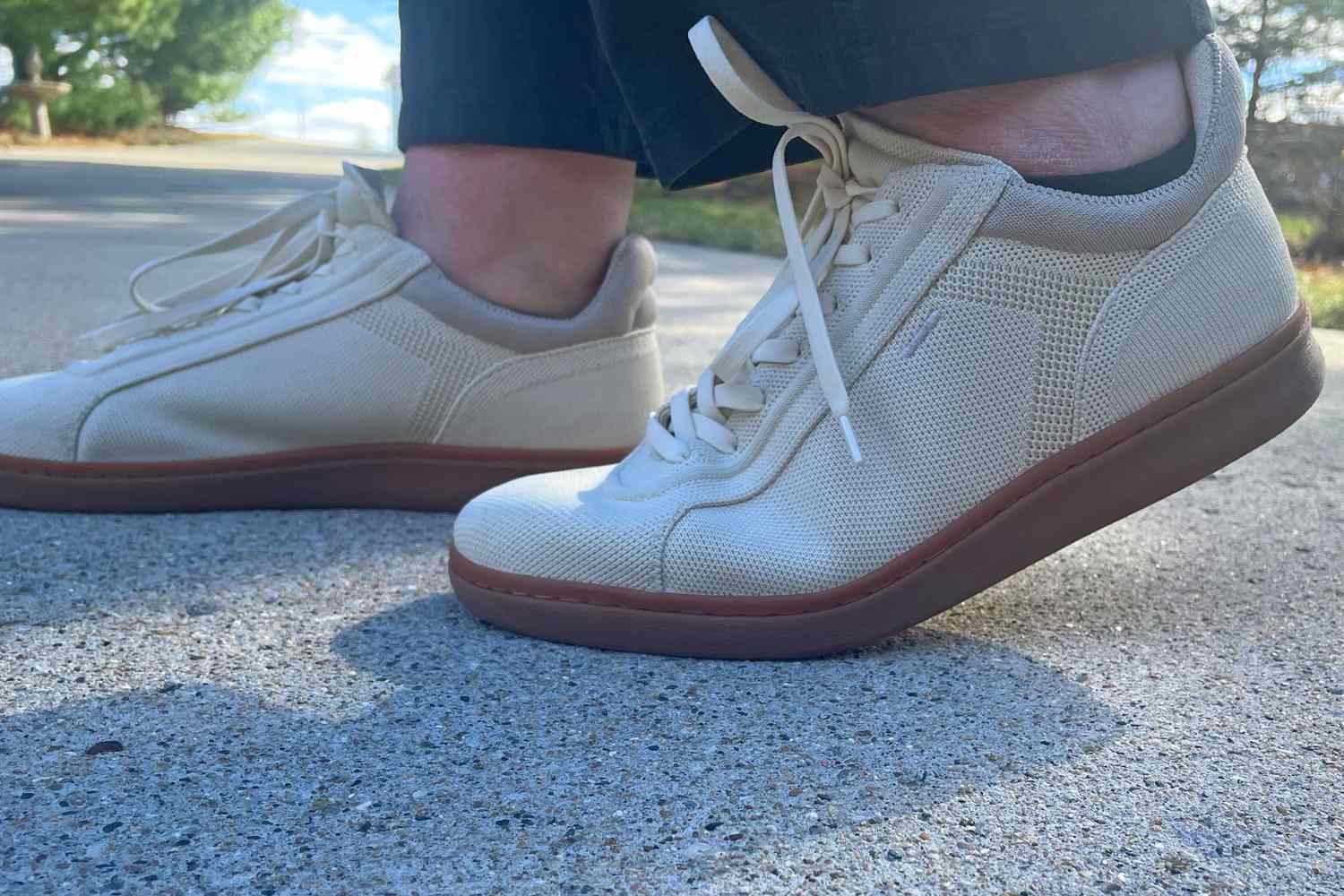 A person walks outside on concrete while wearing the Vivaia V Prime Unisex Casual Sneaker