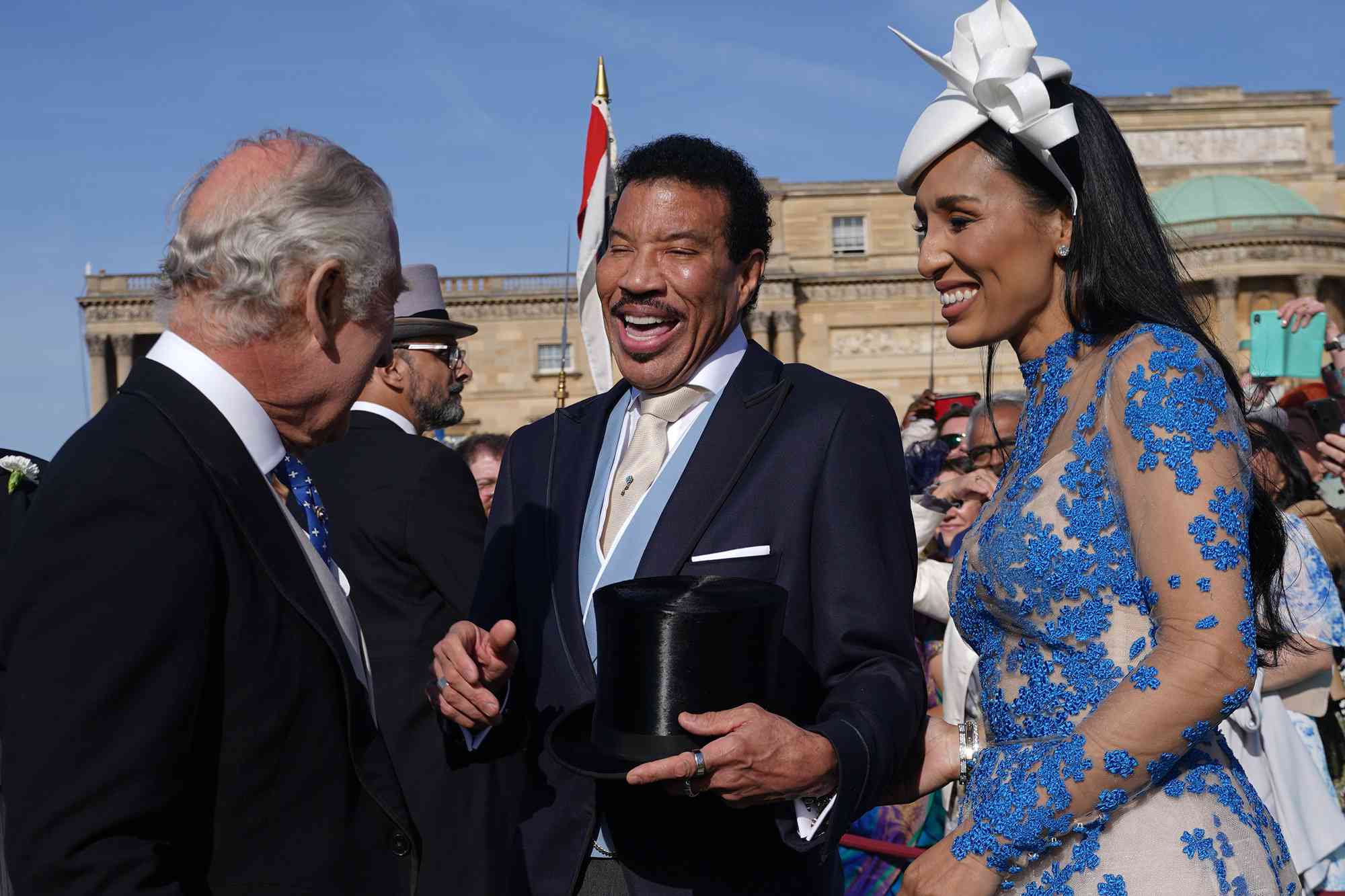 King Charles III speaks with Lionel Richie and Lisa Parigi during the Garden Party at Buckingham Palace ahead of the coronation of the King Charles III and the Queen Consort at Buckingham Palace, on May 3, 2023 in London, England.