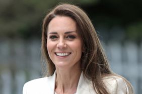 Catherine, Duchess of Cambridge smiles during a visit to Little Village's hub in Brent to meet staff and hear about how the baby bank is supporting local families by ensuring that they have access to essential items for their young children on June 8, 2022 in London