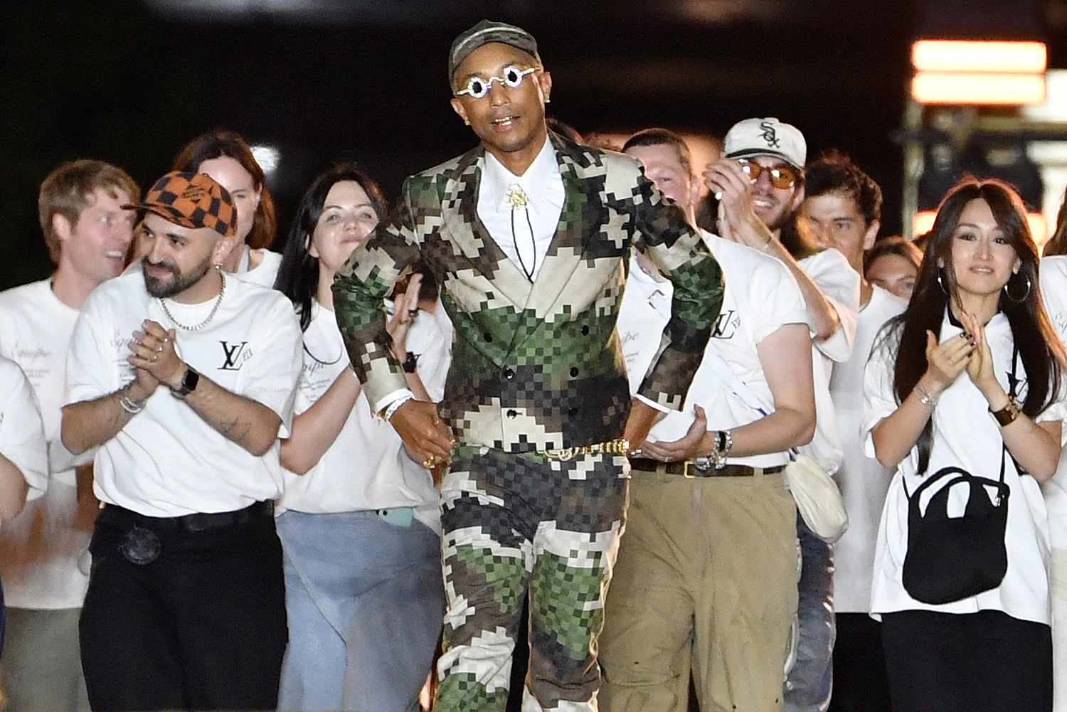 Pharrell Williams acknowledges the audience at the end of the Louis Vuitton Menswear Spring-Summer 2024 show as part of the Paris Fashion Week on the Pont Neuf, central Paris, on June 20, 2023