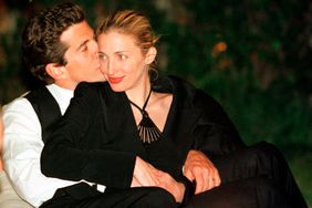 John F. Kennedy, Jr. editor of George magazine, gives his wife Carolyn Bessette a kiss on the cheek during the annual White House Correspondents dinner May 1, 1999 in Washington, DC. 