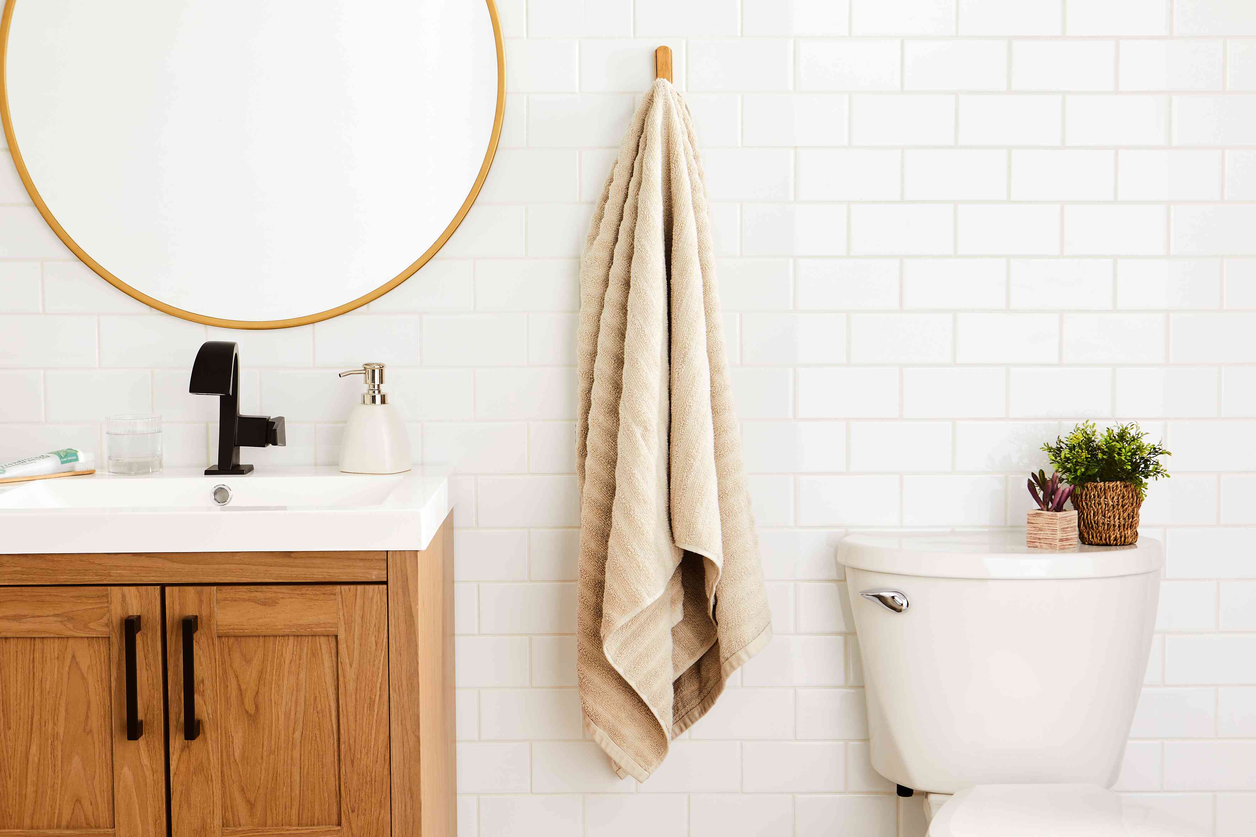 Mainstays Performance Textured Bath Sheet hanging on hook in bathroom