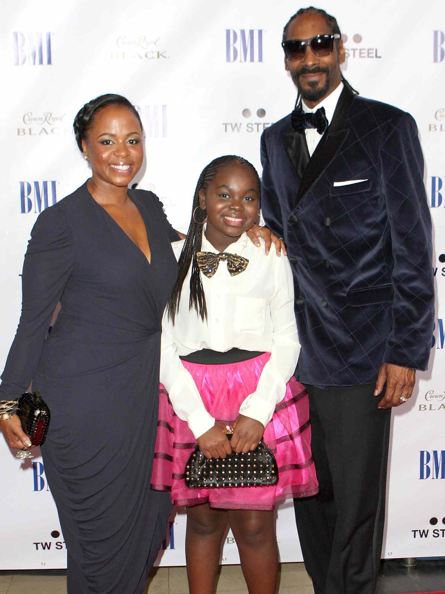 Shante Broadus, Cori Broadus and rapper Snoop Dogg arrive at the 11th Annual BMI Urban Awards on August 26, 2011 in Hollywood, California.