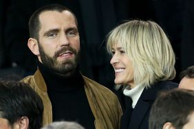 Robin Wright and Clement Giraudet attend the UEFA Champions League Round of 16 Second Leg match between Paris Saint-Germain (PSG) and Real Madrid at Parc des Princes stadium on March 6, 2018 in Paris, France