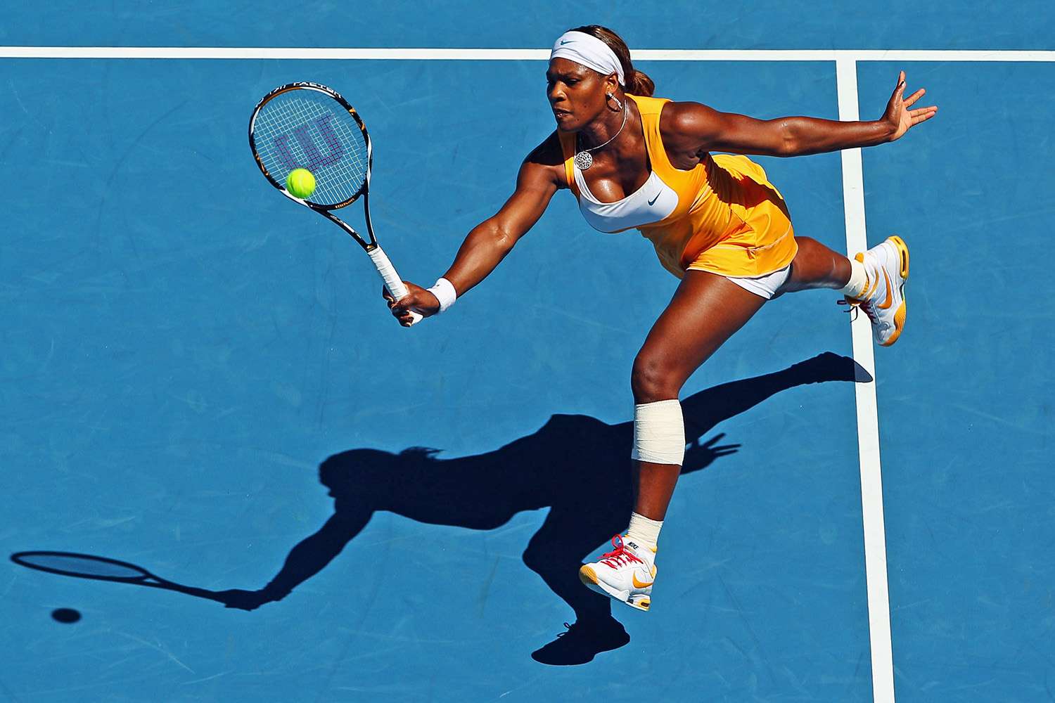 MELBOURNE, AUSTRALIA - JANUARY 27: Serena Williams of the United States of America plays a forehand in her quarterfinal match against Victoria Azarenka of Belarus during day ten of the 2010 Australian Open at Melbourne Park on January 27, 2010 in Melbourne, Australia. (Photo by Cameron Spencer/Getty Images)