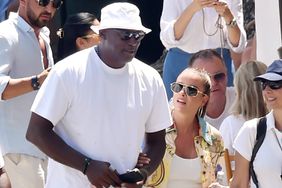 he American Legendary Basketball star Michael Jordan gets all the attention during a stroll around town on his European holiday with his wife Yvette Prieto in Portofino.