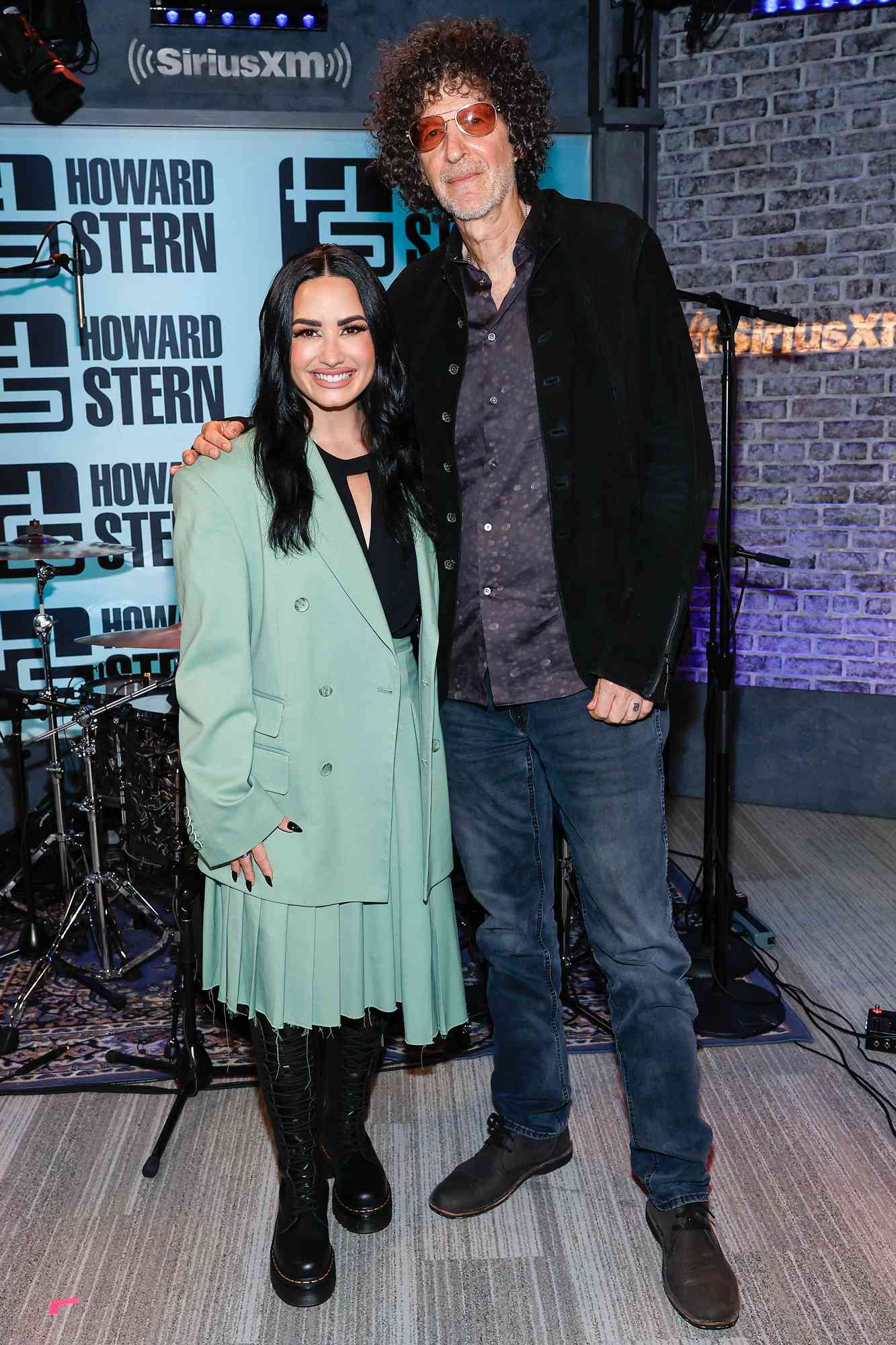 Howard Stern and Demi Lovato pose for a picture at SiriusXM's The Howard Stern Show at SiriusXM Studios on September 11, 2023