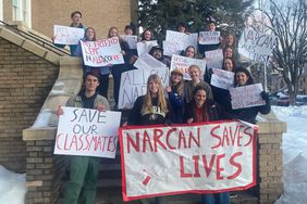 Narcan campaign by kids students standing in front of the school board chambers 