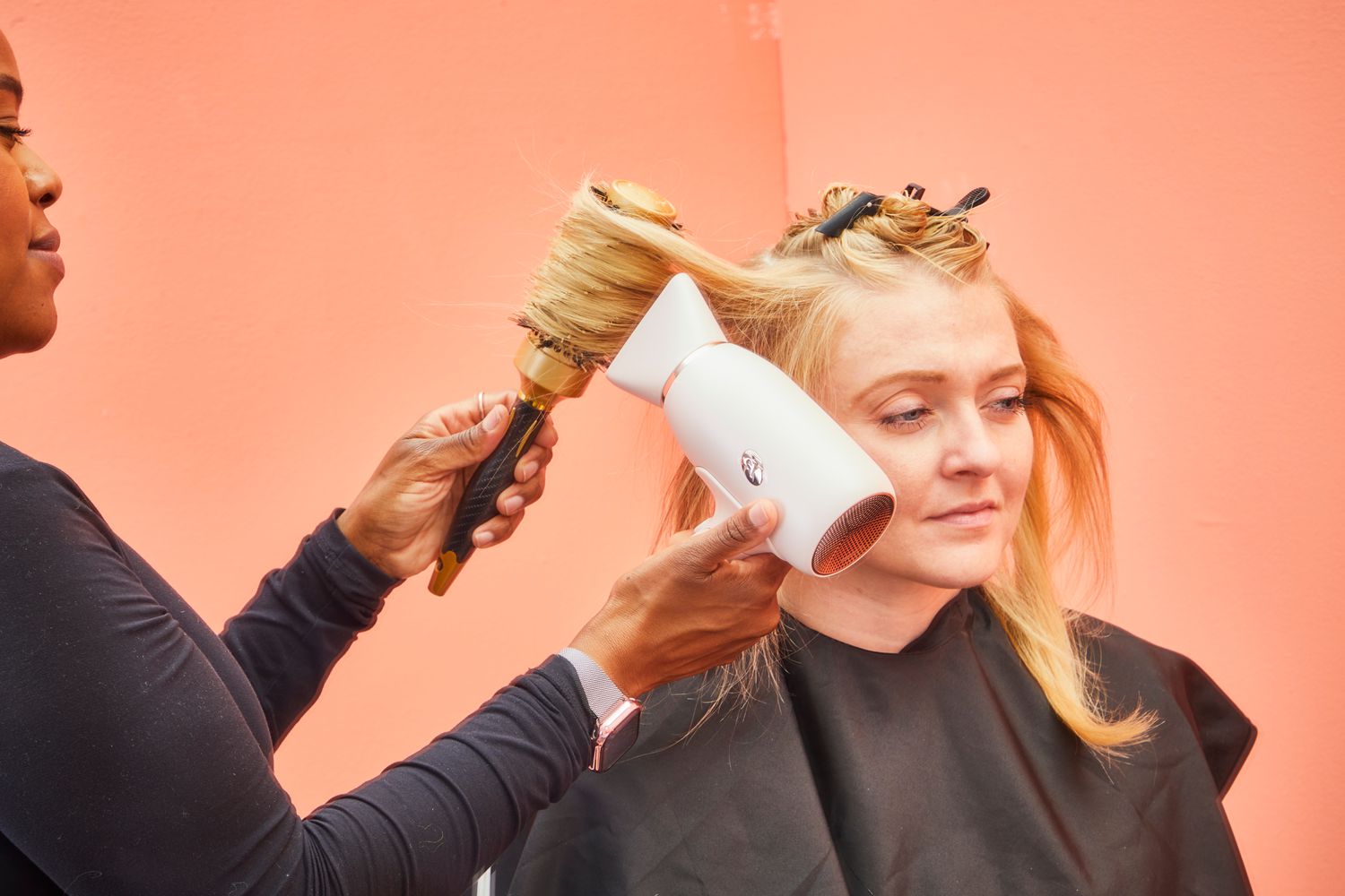 A person getting their hair dried using the T3 Afar Travel Size Hair Dryer.