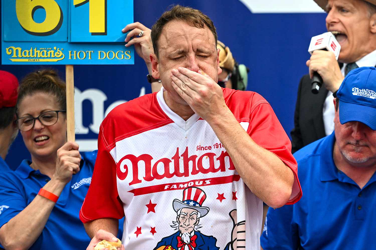 Defending champion Joey Chestnut competes in the 2023 Nathan's Famous Fourth of July International Hot Dog Eating Contest on July 4, 2023 at Coney Island in the Brooklyn borough of New York City. The men's contest was postponed due to thunderstorms but later happened without spectators allowed into the "arena." The annual contest, which began in 1972, draws thousands of spectators to NathanÃ¢ÂÂs Famous located on Surf Avenue.