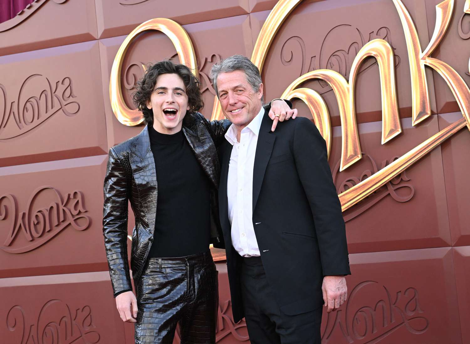 Timothee Chalamet and Hugh Grant attend the Los Angeles Premiere of Warner Bros. "Wonka" at Regency Village Theatre on December 10, 2023 in Los Angeles, California. 