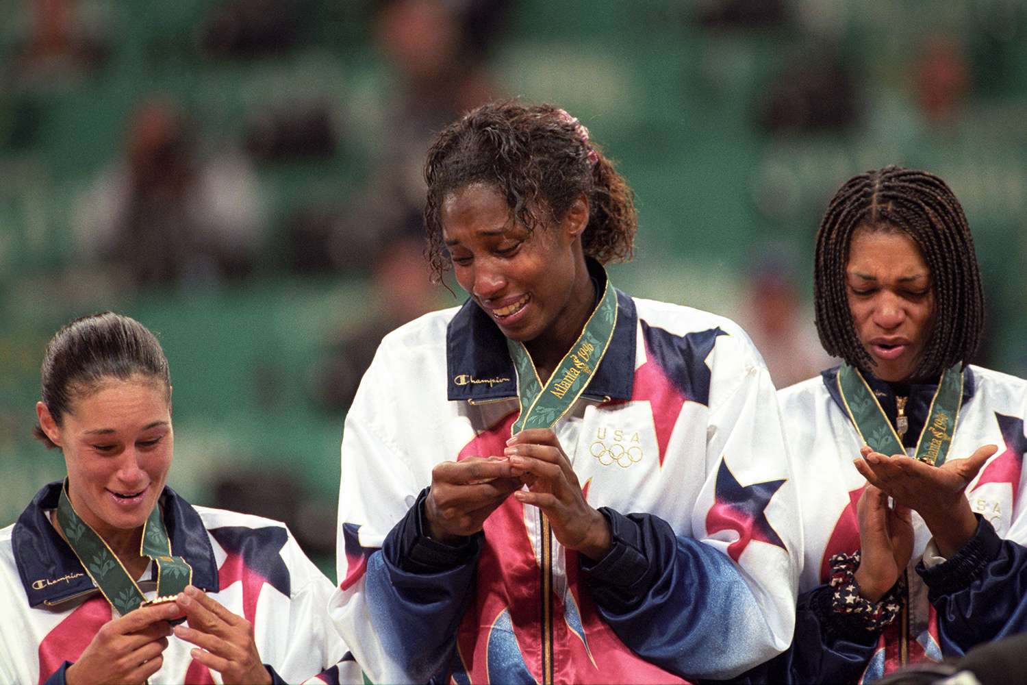 Jennifer Azzi, Lisa Leslie, and Carla McGhee victorious with medals and flowers on stand after winning Women's Gold Medal Game vs Brazil at Georgia Dome in 1996.
