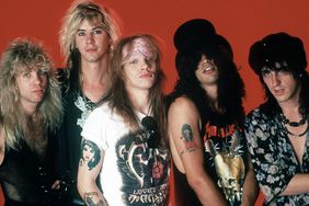 Drummer Steven Adler, Duff McKagan, vocals Axl Rose, guitarist Slash and guitarist Izzy Stradlin of the music group Guns N' Roses pose for a portrait on May 7, 1988, at the Detroit State Theater in Detroit, Michigan.