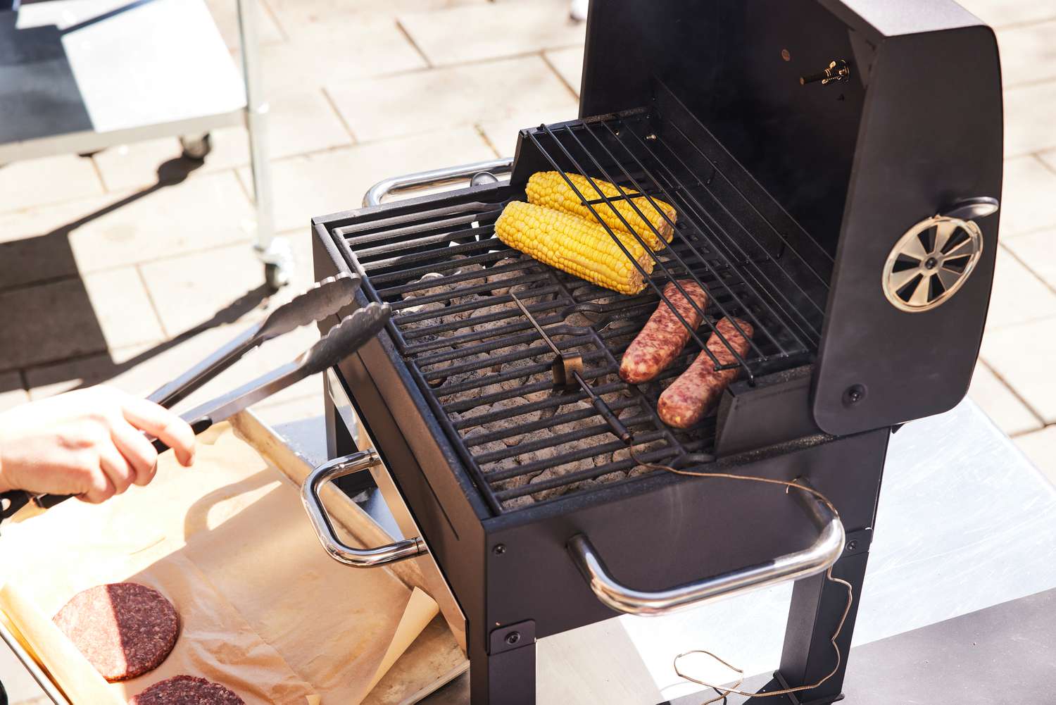 corn and sausage cooking on Expert Grill Premium Portable Charcoal Grill