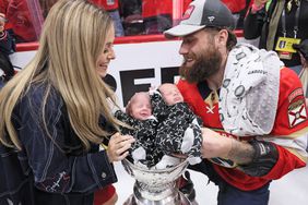 Jonah Gadjovich #12 of the Florida Panthers celebrates with the Stanley Cup following a 2-1 victory over the Edmonton Oilers in Game Seven of the 2024 NHL Stanley Cup Final at Amerant Bank Arena on June 24, 2024