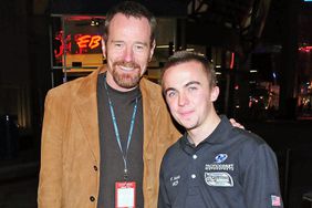 LOS ANGELES, CA - JANUARY 30: Actor Brian Cranston (L) and actor/race car driver Frankie Muniz (R) pose at the press conference for Muniz' new racing team Pacific Coast Motor Sports at the Universal City Hard Rock Cafe on January 30, 2008 in Los Angeles, California. (Photo by Michael Tullberg/Getty Images)