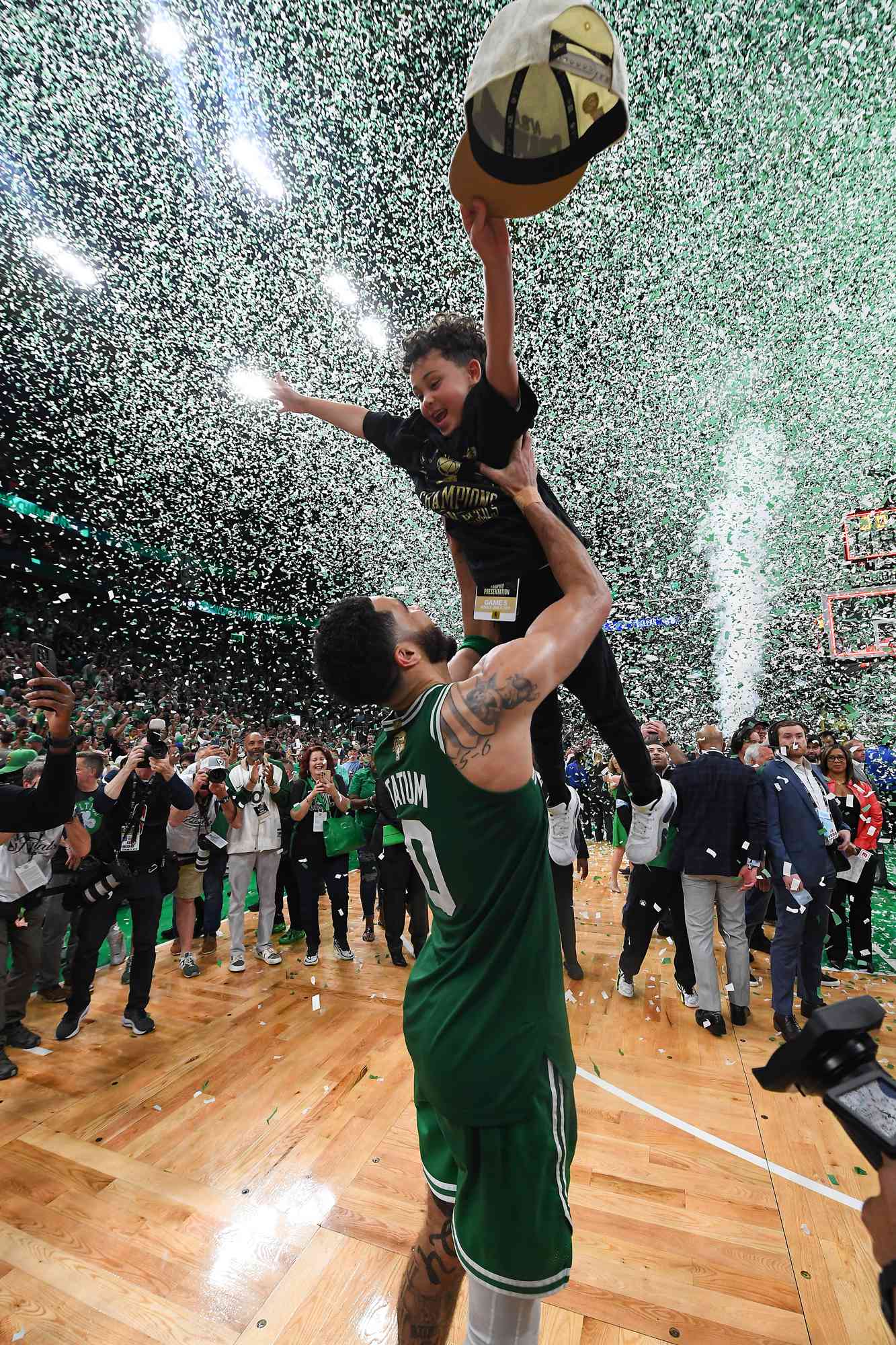 Deuce Tatum and Jayson Tatum #0 of the Boston Celtics celebrate after the game against the Dallas Mavericks during Game 5 of the 2024 NBA Finals on June 17, 2024 at the TD Garden in Boston, Massachusetts.