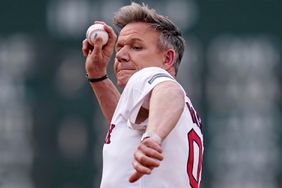 Gordon Ramsay delivers the ceremonial first pitch prior to a baseball game between the Boston Red Sox and Toronto Blue Jays at Fenway Park, Tuesday, June 25, 2024