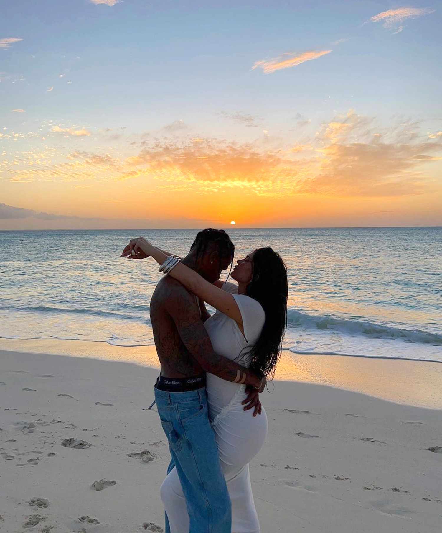 Kylie Jenner and Travis Scott Pose for Romantic Beach Photos and Feed Lizards with Daughter Stormi