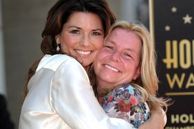 Shania Twain poses with her sister Carrie-Ann Edwards, after being honored by a Star on the Hollywood Walk of Fame in Hollywood, California on June 2, 2011