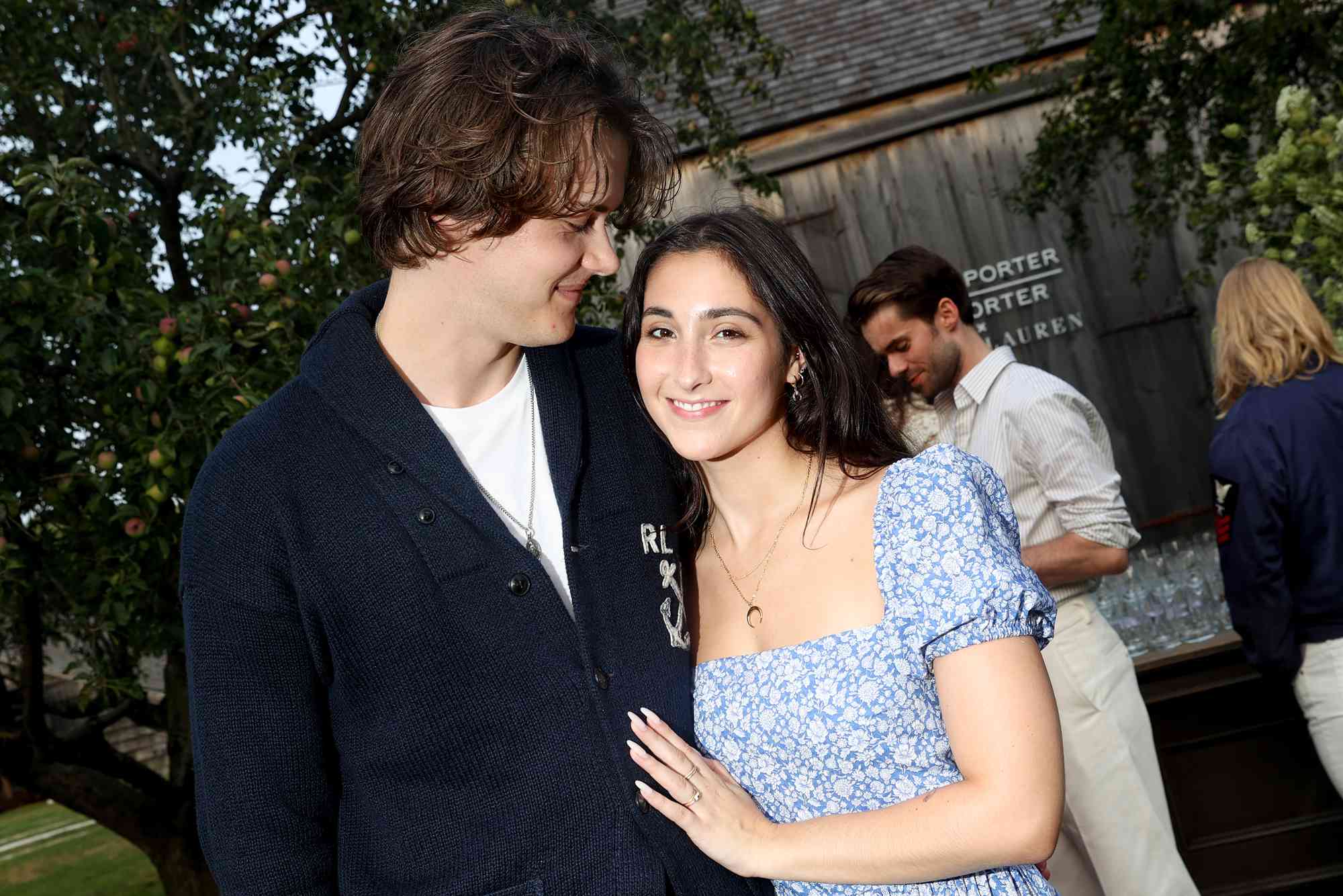 Christopher Briney and Isabel Machado at the Ralph Lauren, NET-A-PORTER and MR PORTER'S Intimate Summer Dinner July 27, 2023 in East Hampton, New York.