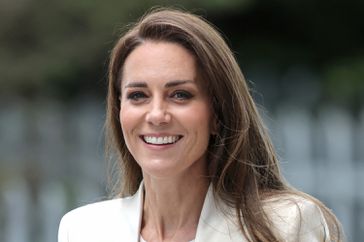 Catherine, Duchess of Cambridge smiles during a visit to Little Village's hub in Brent to meet staff and hear about how the baby bank is supporting local families by ensuring that they have access to essential items for their young children on June 8, 2022 in London