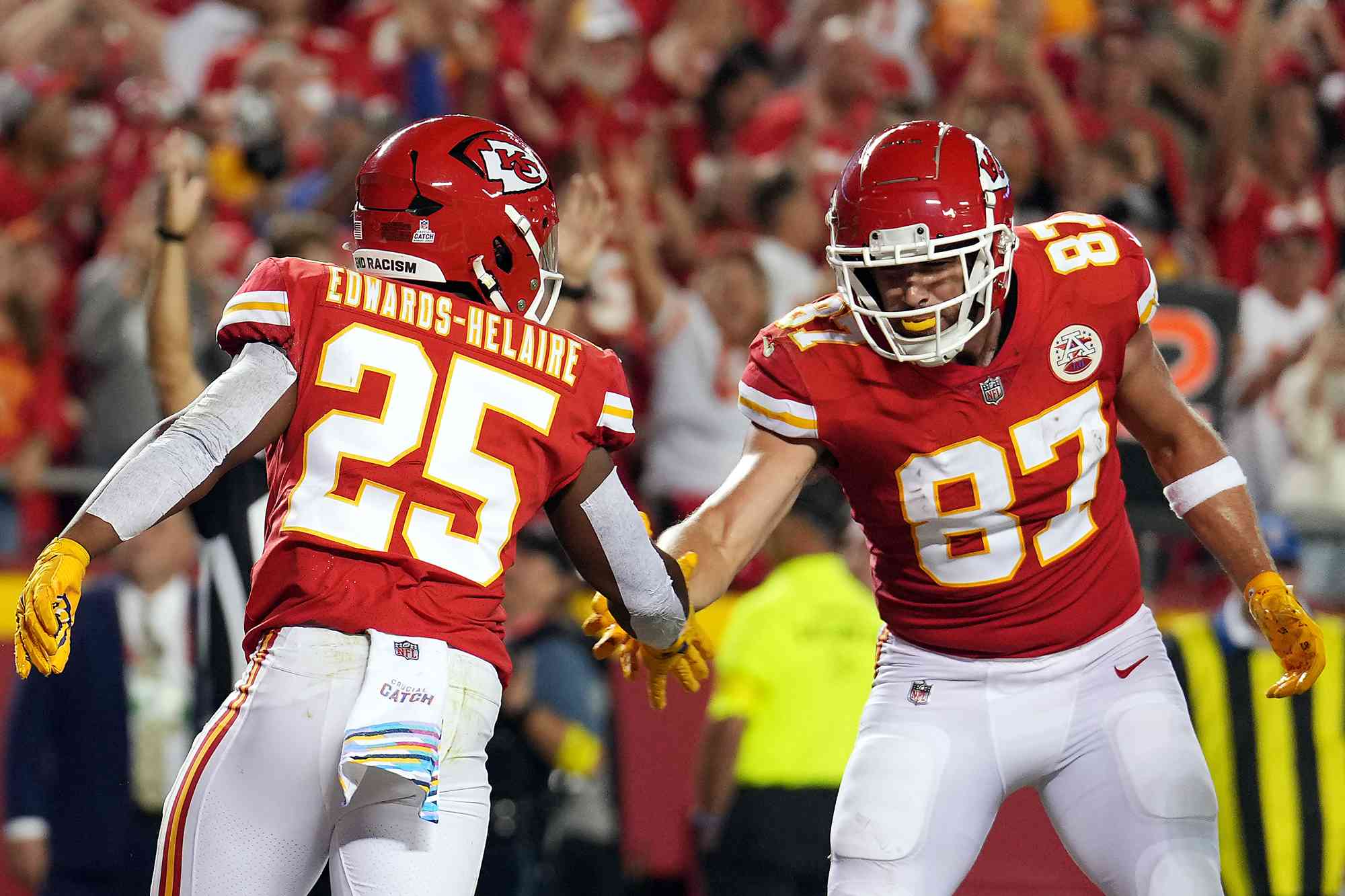 Clyde Edwards-Helaire 25 and Travis Kelce 87 of the Kansas City Chiefs celebrate after a touchdown that was eventually called back during the 1st half of the game against the Las Vegas Raiders at Arrowhead Stadium on October 10, 2022 in Kansas City, Missouri.