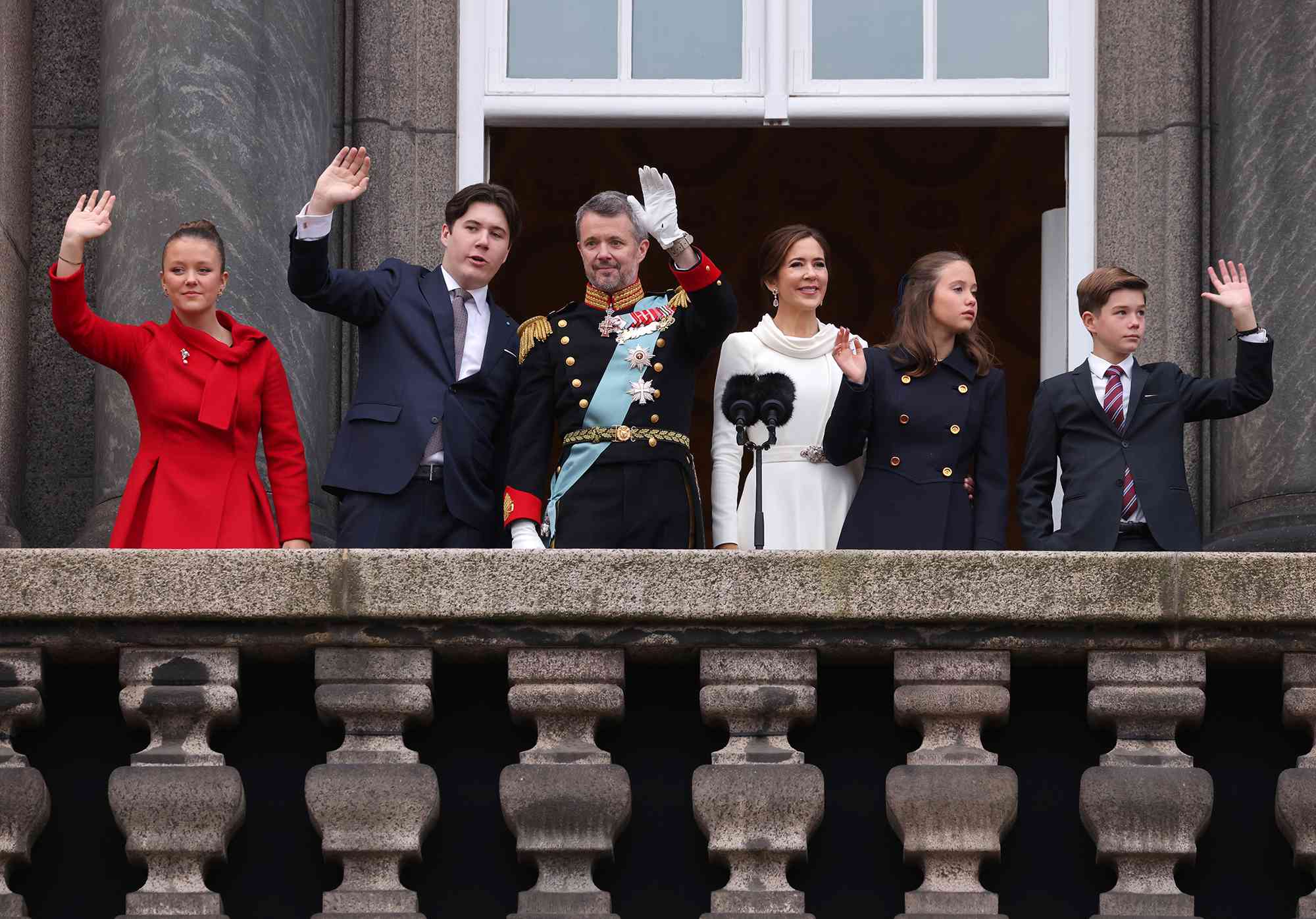 Princess Isabella of Denmark, Prince Christian of Denmark, King Frederik X of Denmark, Queen Mary of Denmark, Princess Josephine of Denmark and Prince Vincent of Denmark wave to the crowd after a declaration of the King's accession to the throne, from the balcony of Christiansborg Palace