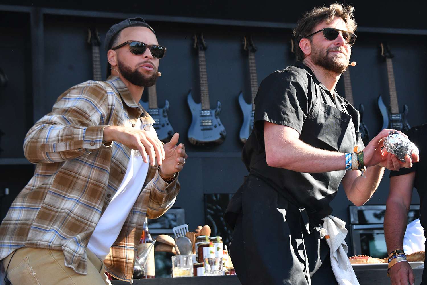 Bradley Cooper and partner Danny DiGiampietro promote Danny and Coops Cheesesteaks alongside Steph Curry and Jose Andres on the Williams Sonoma Culinary Stage at the BottleRock Food and Music Festival in Napa