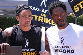 Colin Farrell and Tory Kittles walk the picket line in support of the SAG-AFTRA and WGA strike on July 26, 2023 in Los Angeles, California.