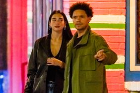 Trevor Noah and Dua Lipa head out for a date night in New York City. The couple were spotted hugging and kissing in the street after dinner.
