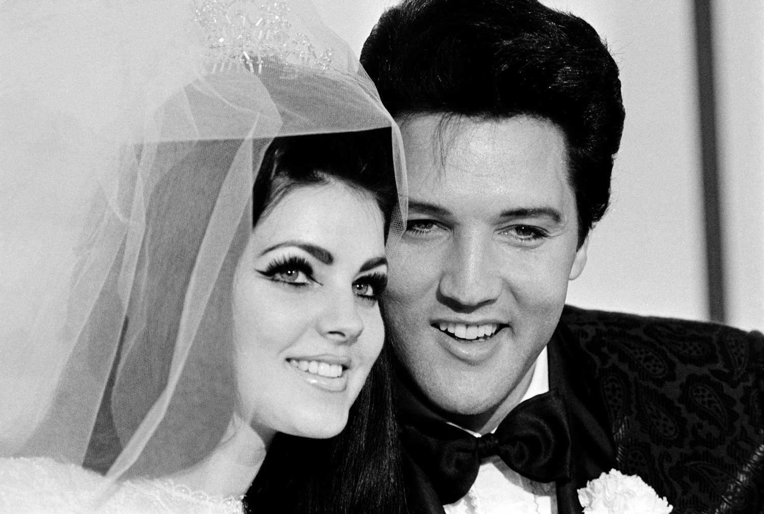 Singer Elvis Presley and his bride Priscilla Ann Beaulieu, pose for photograph following their wedding at the Aladdin Hotel.