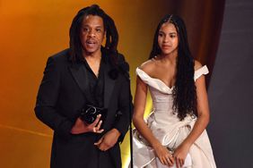 US rapper Jay-Z (L) accepts the Dr. Dre Global Impact Award alongside his daughter Blue Ivy on stage during the 66th Annual Grammy Awards at the Crypto.com Arena in Los Angeles on February 4, 2024. 