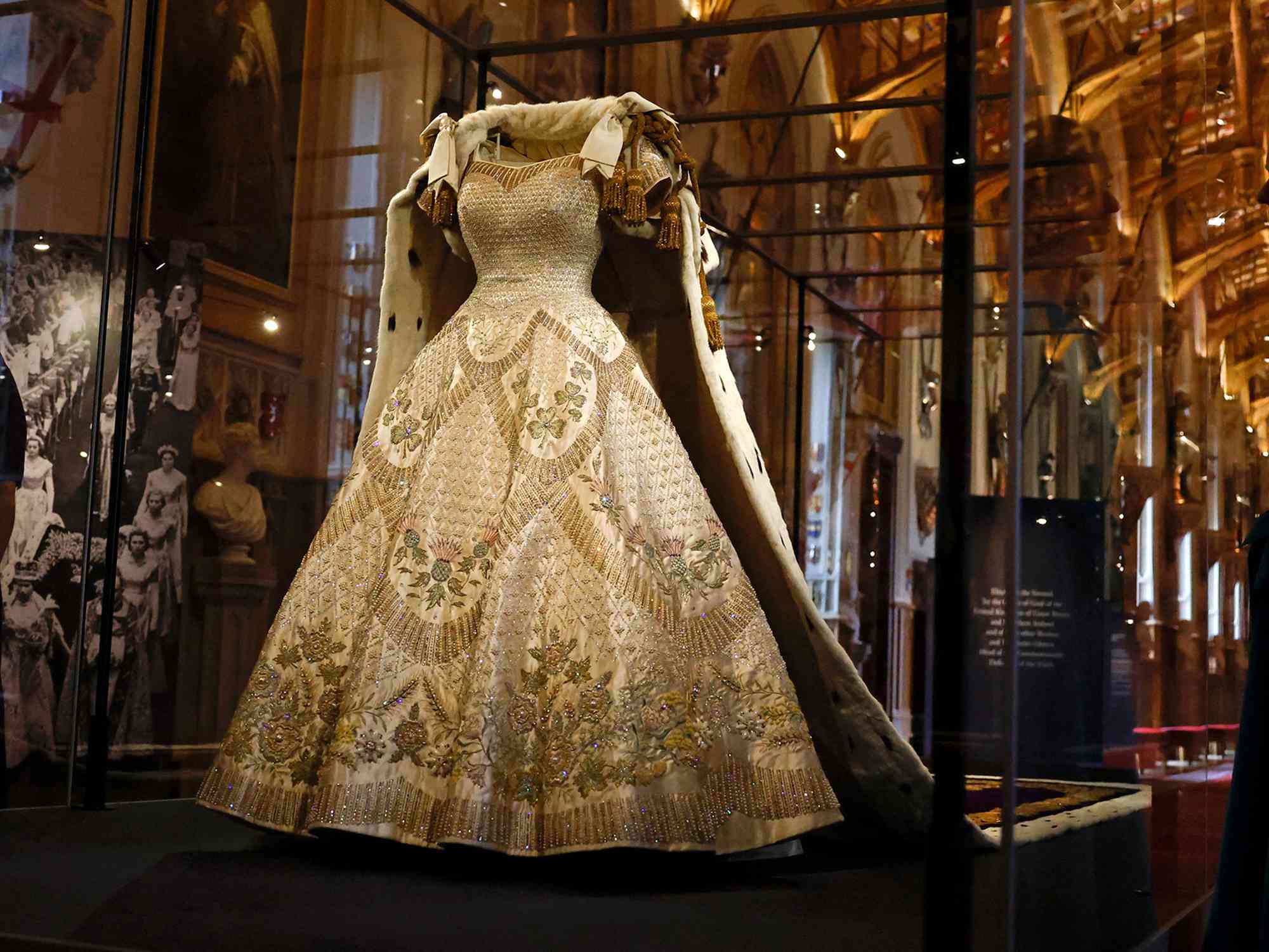 The Coronation Dress and Robe of Estate, worn by Britain's Queen Elizabeth II on her 1953 coronation, and designed by Norman Hartnell and Ede & Ravenscroft respectively, are pictured during a press preview for the Platinum Jubilee - The Queens Coronation exhibition, in St George's Hall at Windsor Castle in Windsor on July, 6, 2022