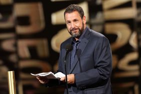 SANTA MONICA, CALIFORNIA - FEBRUARY 18: 2024 PEOPLE'S CHOICE AWARDS -- Pictured: Adam Sandler speaks onstage during the 2024 People's Choice Awards held at Barker Hangar on February 18, 2024 in Santa Monica, California. --