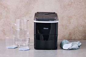 Silonn Countertop Ice Maker displayed next to a pitcher and glasses