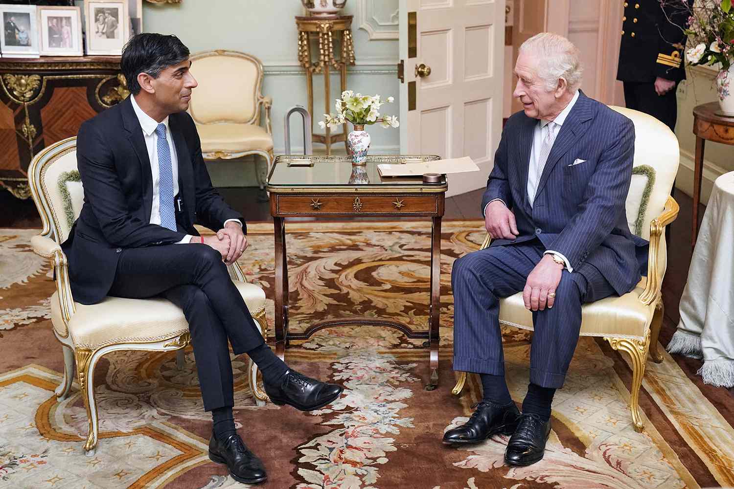 Britain's King Charles III (R) speaks with Britain's Prime Minister Rishi Sunak at Buckingham Palace, in central London, on February 21, 2024 for their first in-person audience since the King's diagnosis with cancer.