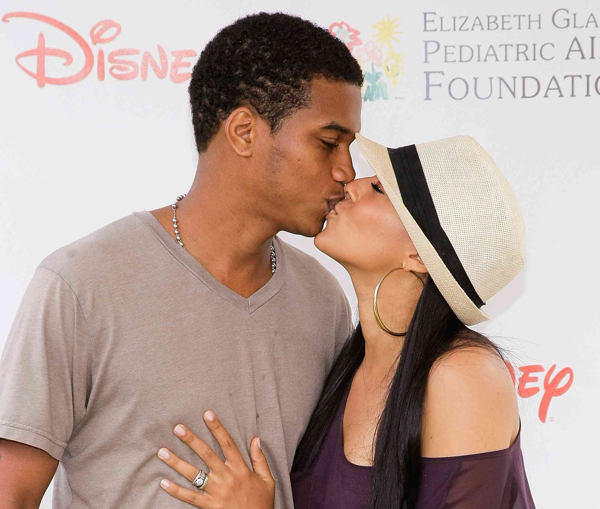 Tia Mowry (R) and Cory Hardrict kiss at the 21st annual "A Time For Heroes" celebrity picnic at the Wadsworth Theater on June 13, 2010 in Los Angeles, California