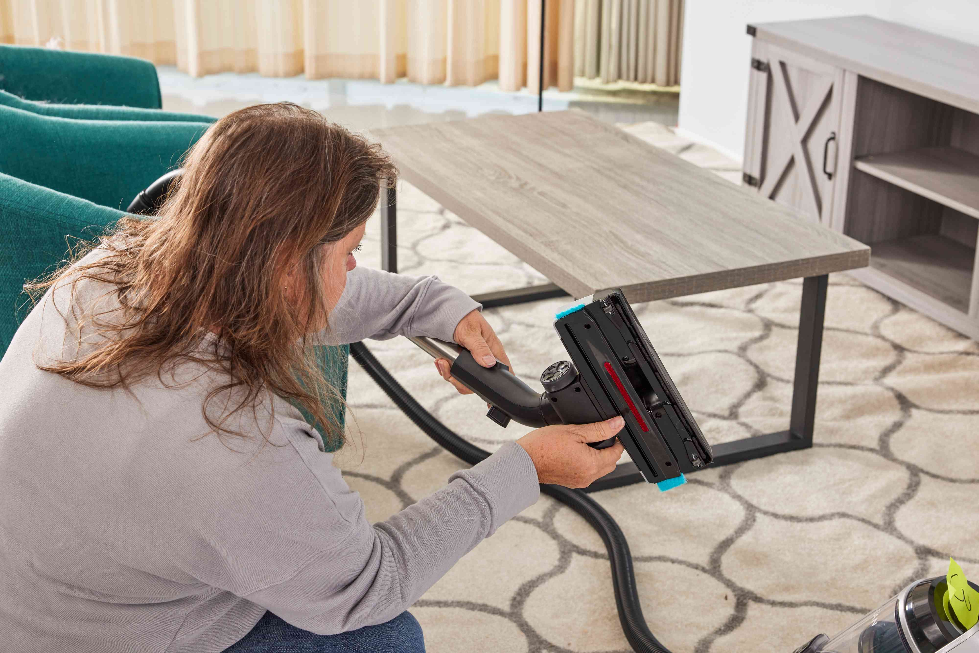 A person assembles the Bissell SmartClean Canister Vacuum