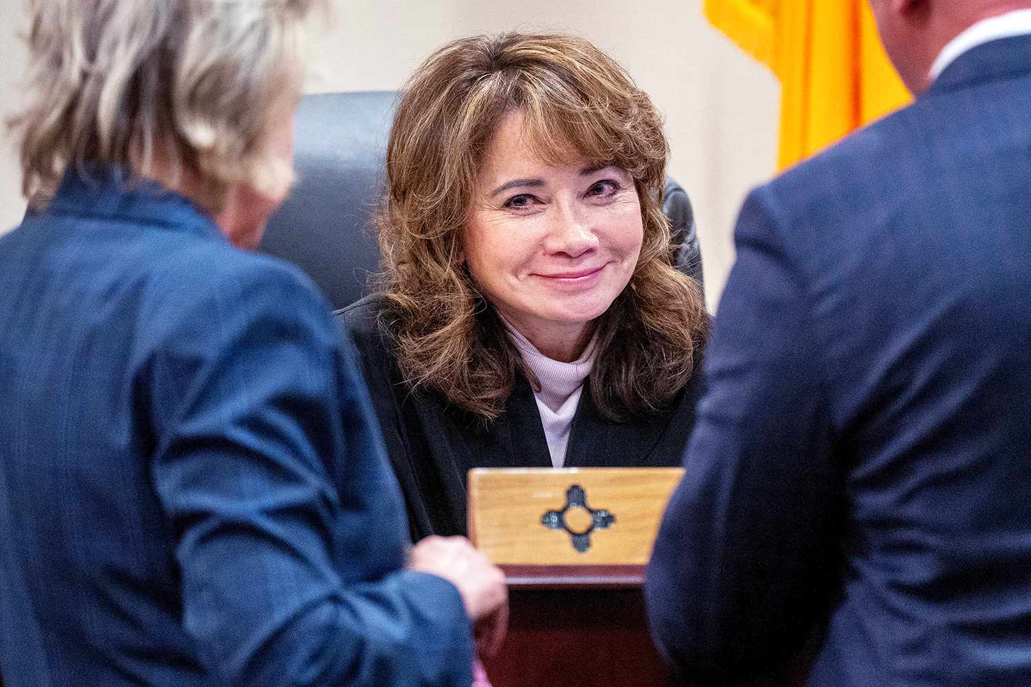 Judge Mary Marlowe Sommer (center) talks with prosecutor Kari T. Morrissey (left) in February.