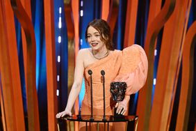 Emma Stone accepts the Leading Actress Award for 'Poor Things' during the 2024 EE BAFTA Film Awards, held at the Royal Festival Hall on February 18, 2024 in London, England. 