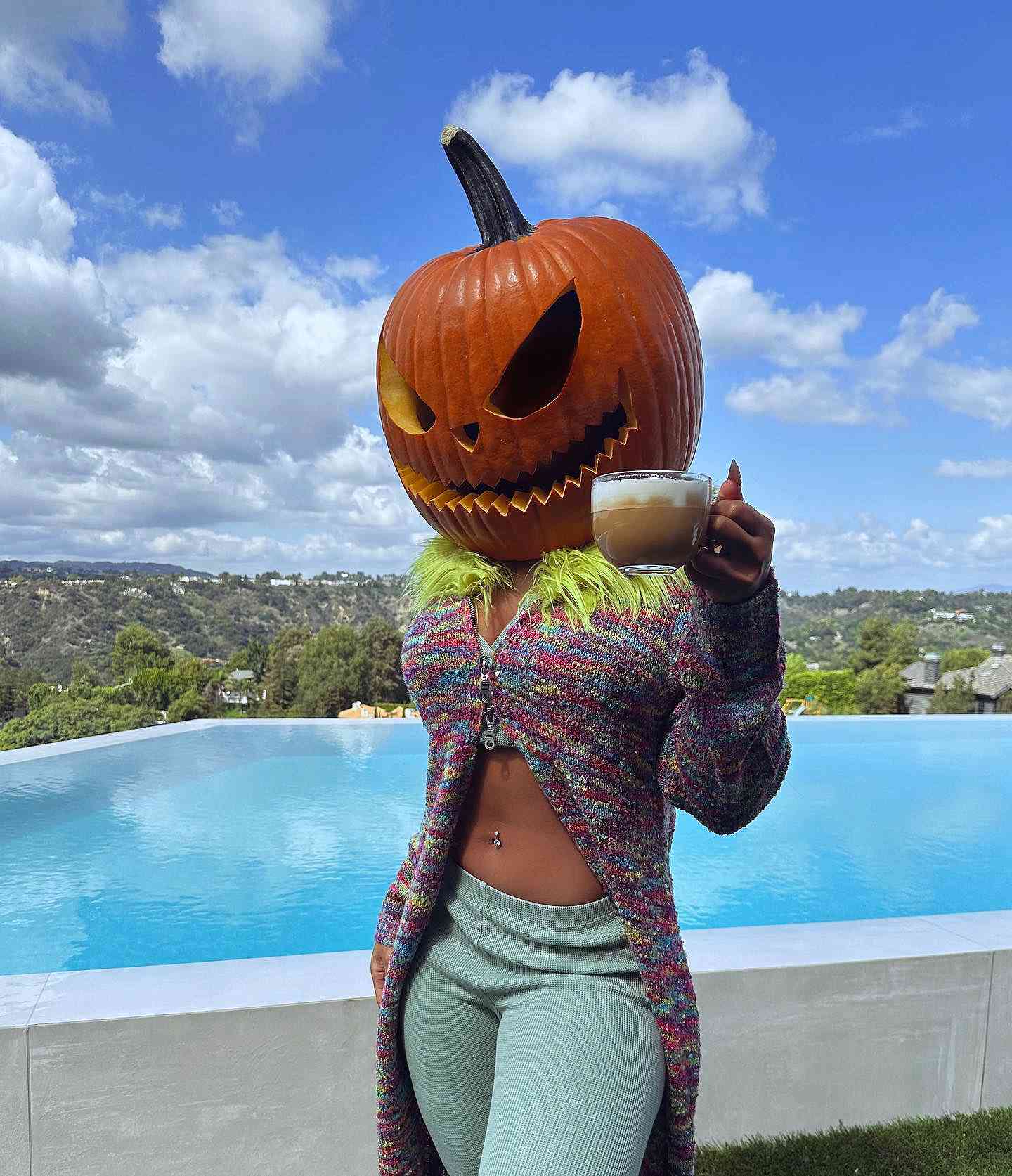 Megan Thee Stallion Gets Into the Halloween Spirit Early with Giant Pumpkin Head Mask 