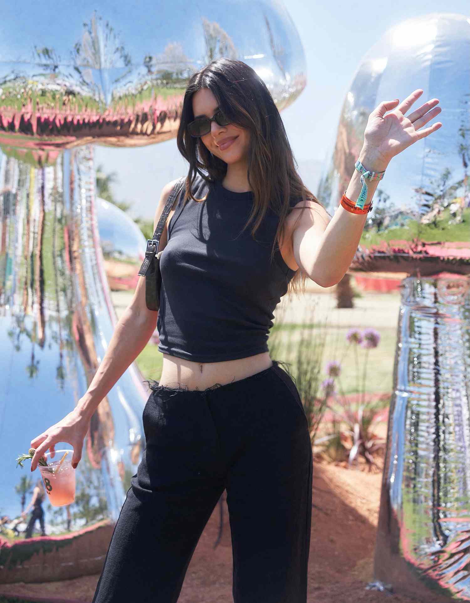 Kendall Jenner stops by her 818 Tequila pop-up bar at the Revolve Festival